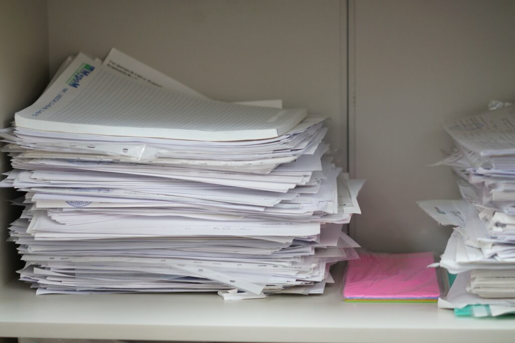 Documents and papers in a pile, documents in an office